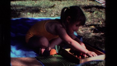 1981: Little Girl Playing with Toys Outside California