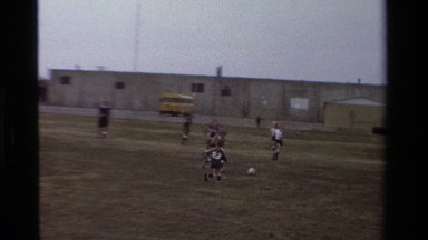 1981: the referee in a black and white striped shirt kicks the ball CALIFORNIA