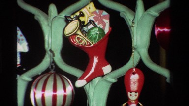 1981: Various Holiday Decorations Hung on a Fence Structure in California