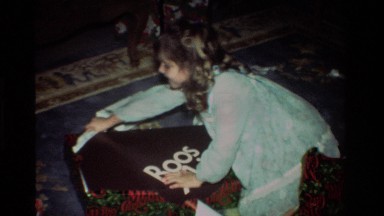 1981: Baby Eagerly Opens Gift at Family Celebration in California