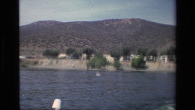 1977: A Boat Pulls a Water Skier Behind It on a Long Rope Canyon Lake California