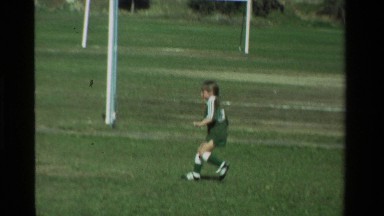 1981: A Little Girl in a Green Soccer Uniform Plays Soccer in California