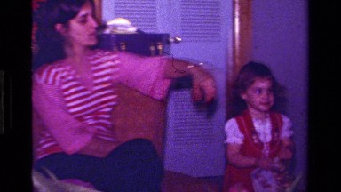 1979: A Brown Haired Girl Walks Through a Room in California