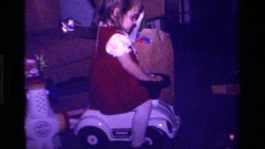 1979: a small girl playing with her toy car and enjoying the same CALIFORNIA