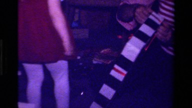 1979: a girl in red dress is looking out for some plaything CALIFORNIA
