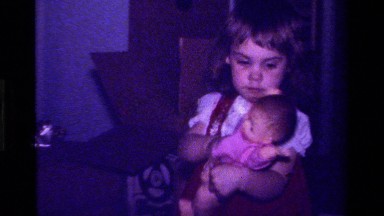1979: Girl Playing with a Doll in California