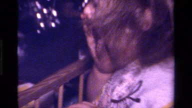 1979: a baby has chocolate on her hands and puts it in her mouth CALIFORNIA