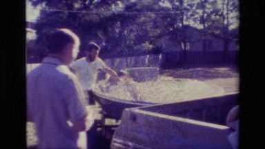 1977: two men stand around their vehicles on a sunny day LAKE ELSINORE