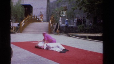 1984: a man does slow movements in a yoga format, vintage clip