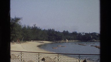 1984: Beach Front View Zooming In on Pier Across Bay Hong Kong