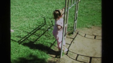 1979: Toddler Climbing Rails to Reach Monkey Bars in California