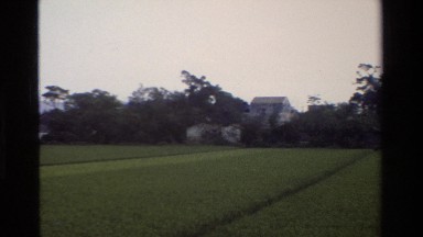 1984: scanning of an area with a building and many trees ZHONGSHAN CHINA