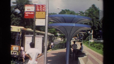 1984: A Bus Starting to Move Away from the Stop Singapore