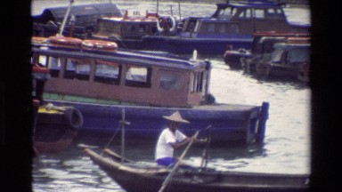1984: man sitting in the boat SINGAPORE