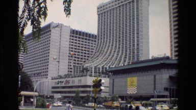 1984: Geometric White Buildings in Singapore City with Modern Architecture and Checkerboard Patterns