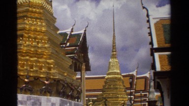 1984: gold spires sit on top of golden towers at a temple THAILAND
