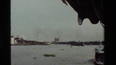 1984: a marshy body of water with industry on far bank THAILAND