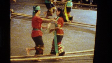 1984: people perform a cultural dance back and forth over bamboo sticks THAILAND