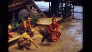 1984: two cocks engaged in a fight while onlookers bet their money on the winner