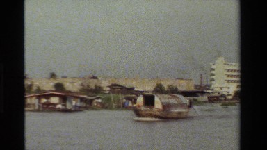1984: boat travel in the river,baby plays with their da. THAILAND