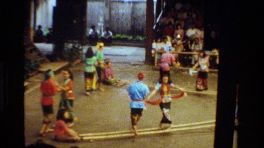 1984: using large bamboo sticks, native dancers perform for a crowd THAILAND