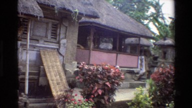 1984: Rural Cambodian Village with Airy Buildings, Grass Roofs, and Stone Pillars