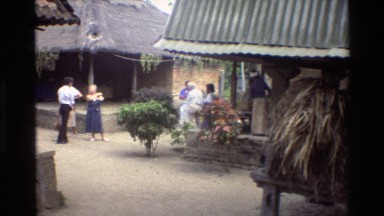 1984: A Group of People Standing Outside and Talking in Cambodia