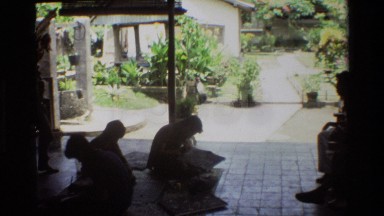1984: Man Sits in Open-Air Room Reading Newspaper Singapore