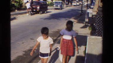 1984: families walking down the sidewalk SINGAPORE
