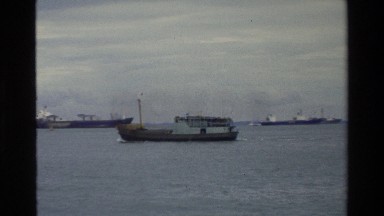 1984: huge industrial area boats moving along SINGAPORE