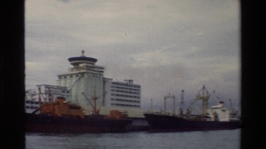 1984: A Large Waterway Flanked by Buildings in Singapore