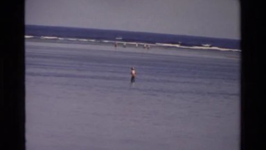 1984: People Standing at Edge of Sea with Sailboats and Yachts in Singapore