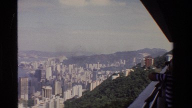 1984: A Person in a Striped Shirt Looks Out Over Hong Kong from a High Vantage