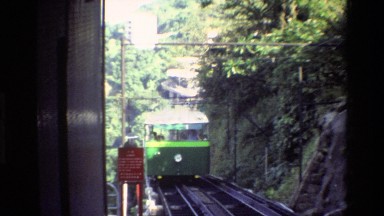 1984: a white and green trolley slowly pulls into the station HONG KONG