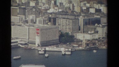1984: a two story oval structure sits on top of two wide pillars HONG KONG