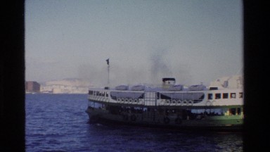 1984: ship sailing from port with people on board HONG KONG