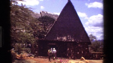 1983: A Zoomed-In Shot of a Building with People Entering