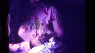 1975: a mom feeding baby during christmas CALIFORNIA