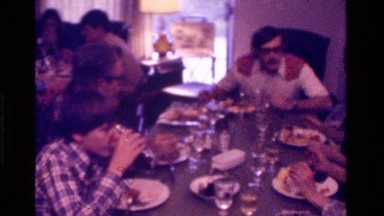 1975: a nice big family sitting at a table eating CALIFORNIA