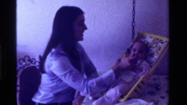 1975: mother spoonfeeding baby daughter CALIFORNIA