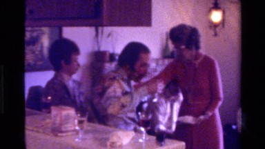 1975: a family get-together in the living room with drinks being served