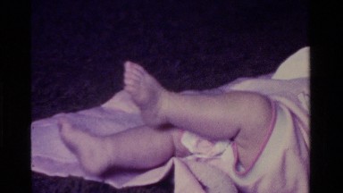 1975: an infant's legs and feet kicking CALIFORNIA