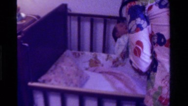 1975: Mom Putting Baby to Sleep in California