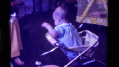 1975: small baby girl is playing with her mother in a room CALIFORNIA