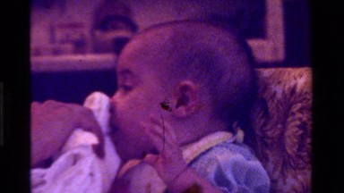 1975: Someone Cleaning the Face of a Small Baby with Towel California