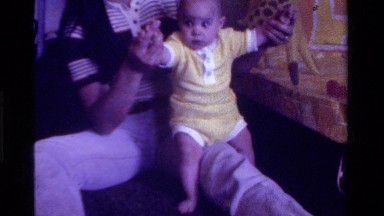 1975: a mother playing with baby in home with happiness CALIFORNIA