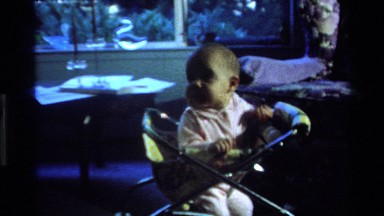 1977: young baby sitting in high chair CALIFORNIA