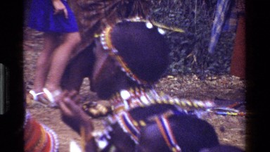 1983: A Black Woman Adorned with Ornaments Laughs and Plays in Kenya