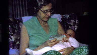 1977: grandma feeding a little baby CALIFORNIA