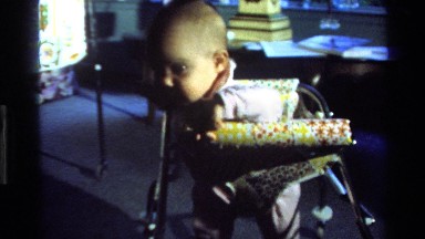 1977: baby learns to walk using a walker CALIFORNIA